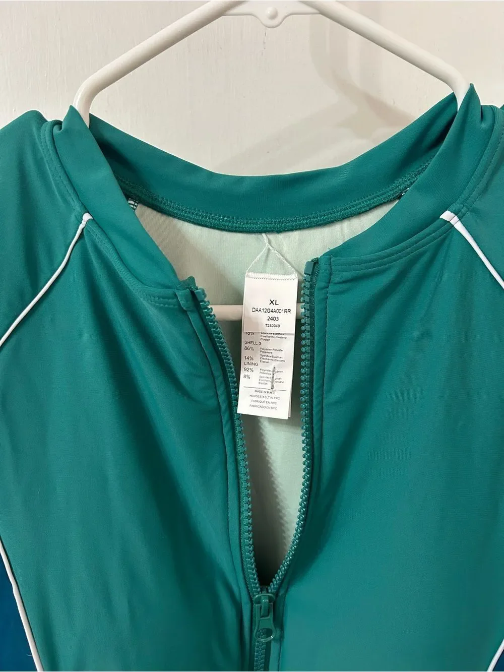 Never Worn Teal and Navy Long Sleeve Zip Front Swimsuit